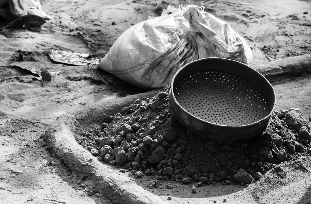 Screening of sand and clay in an Indian village